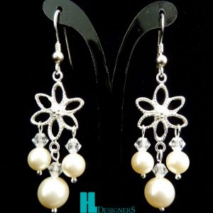 Brincos pérolas e tupis